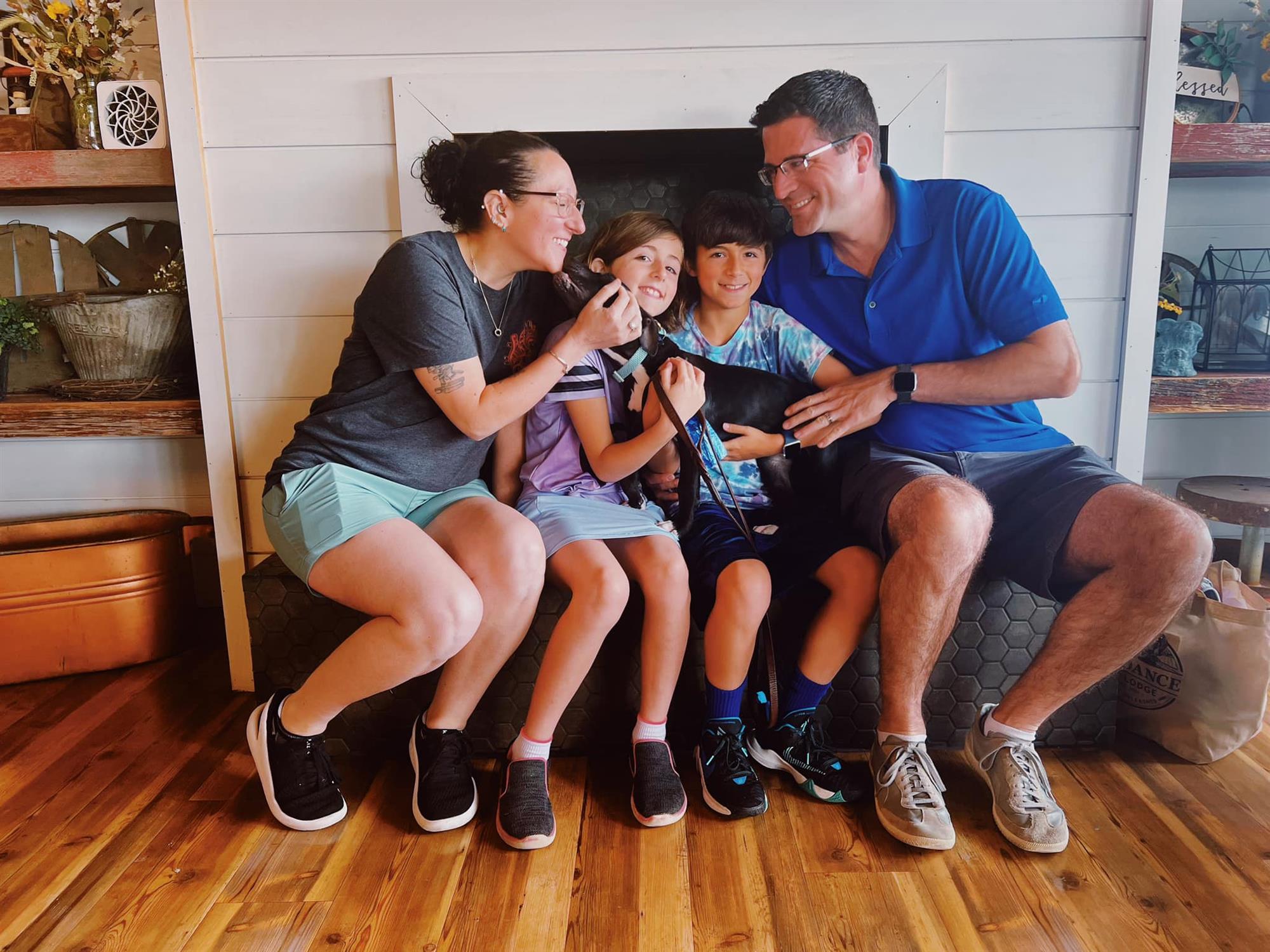 Happy Family Adopts New Dog