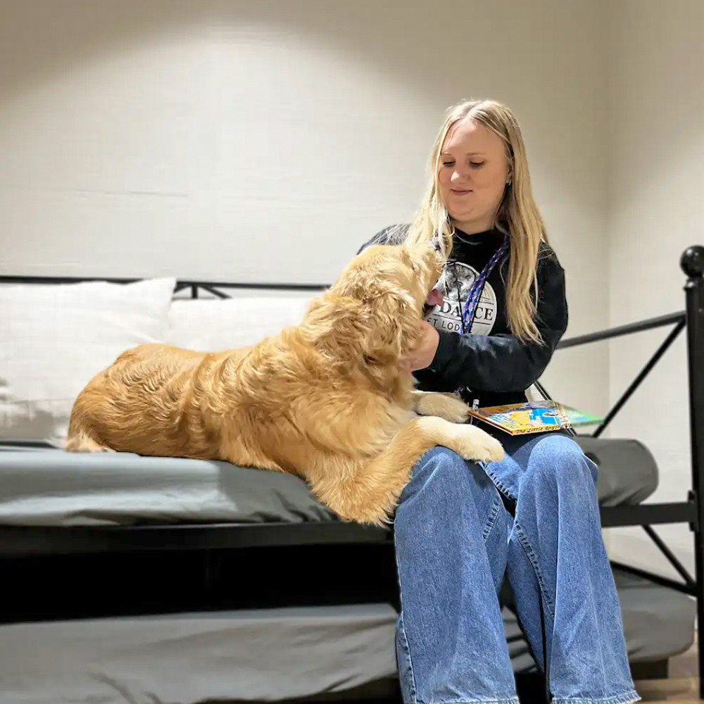 Dog and caregiver at bedtime